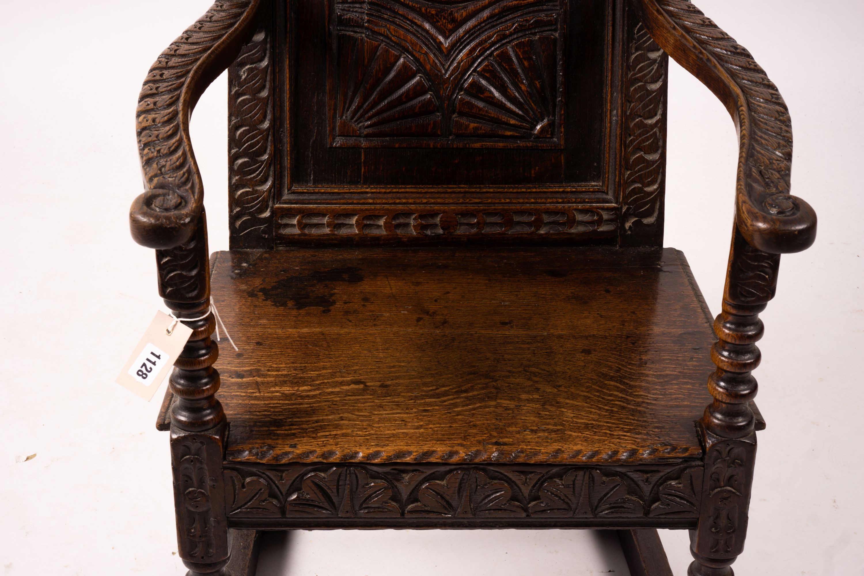 An 18th century style carved oak wainscot chair, width 56cm, depth 60cm, height 101cm